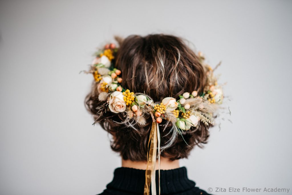Flower crown on a woman's head seen from behind