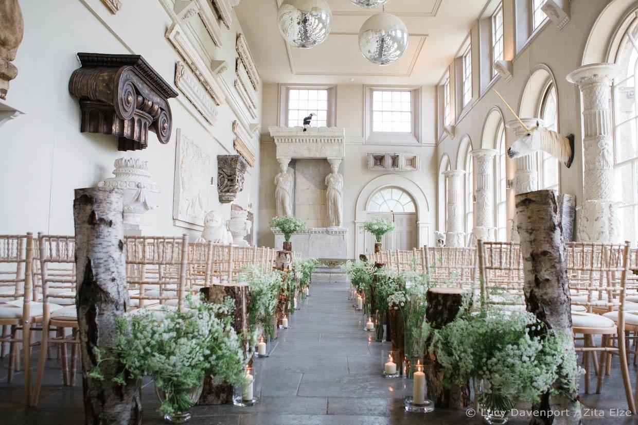 Wedding floral arrangement on the chairs