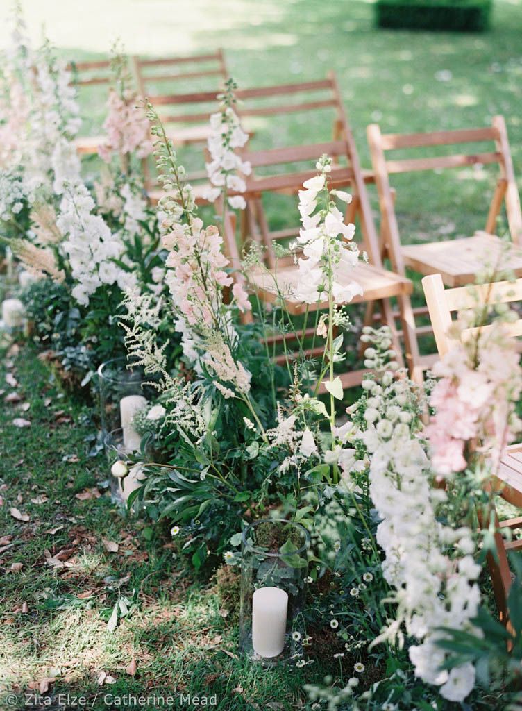 Floral arrangements on chairs for a wedding