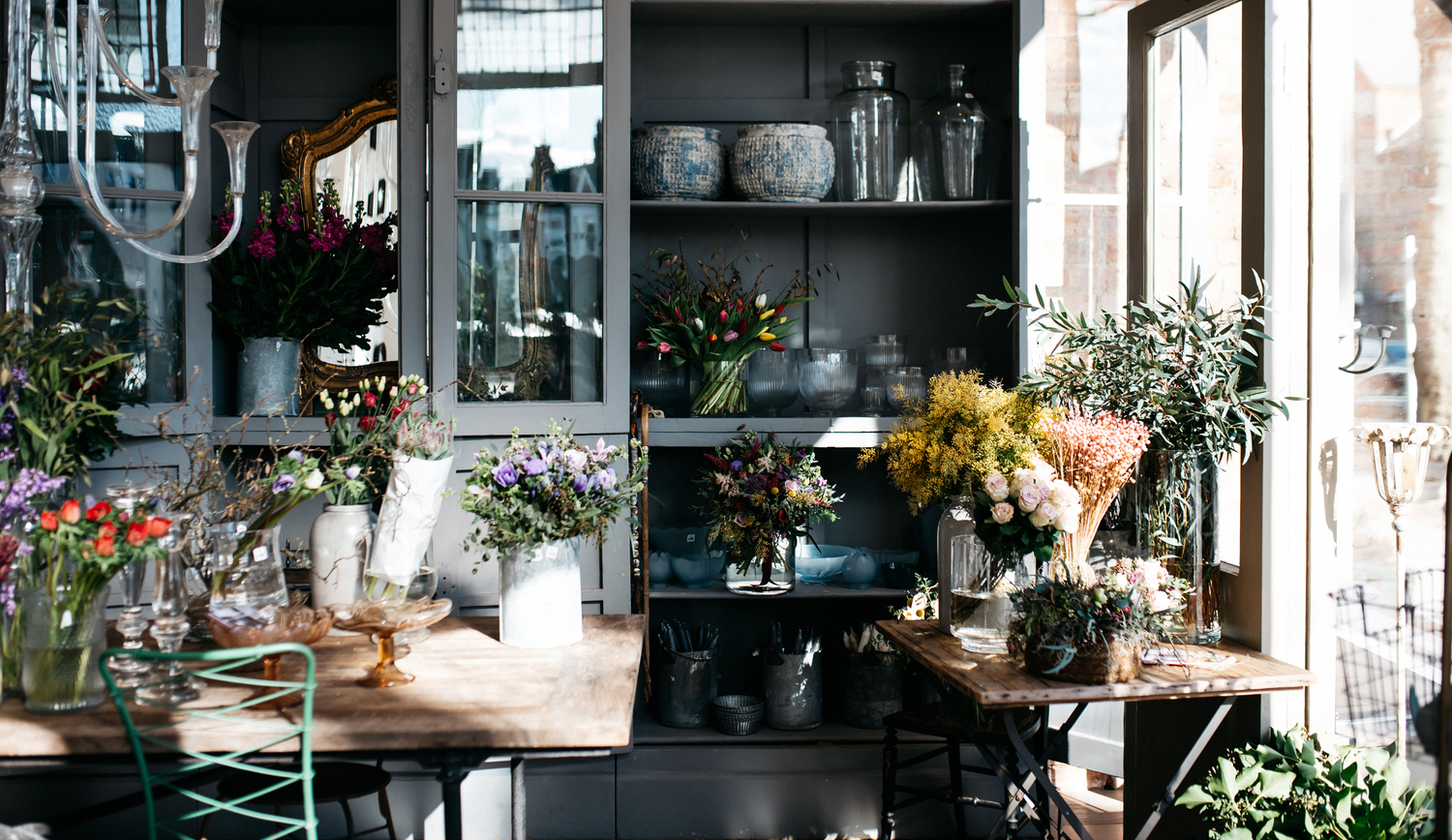 Interior of a flower shop with vases and flowers