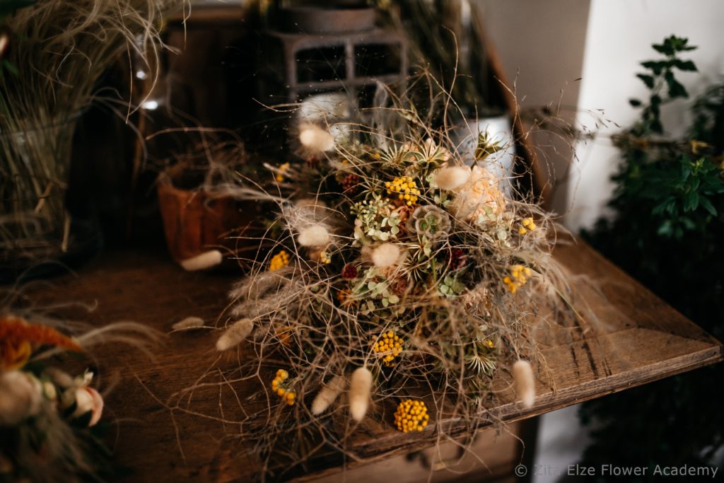 Dried flowers bouquet on a wooden table